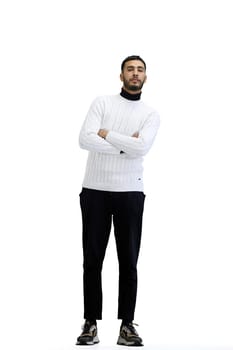 A man, full-length, on a white background, crossed his arms.