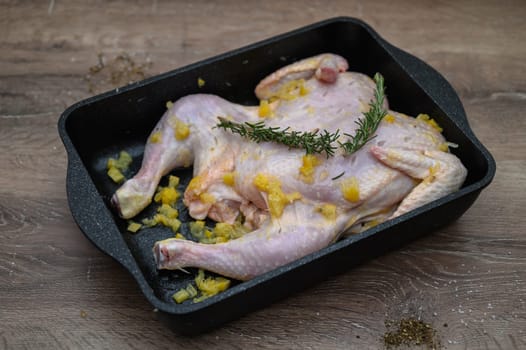 chicken tabaka marinated before cooking in the kitchen 12