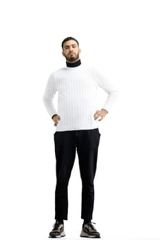 A man, full-length, on a white background, warming up.