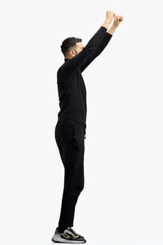 A man, full-length, on a white background, waving his arms.