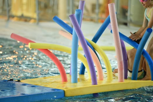 Colorful wacky Noodles in swimming Pool Toys Foam Stick, Swimming Pool Noodles.