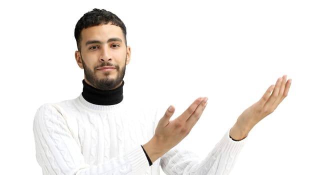 A man, close-up, on a white background, points to the side.