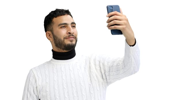 Man, close-up, on a white background, using a phone.