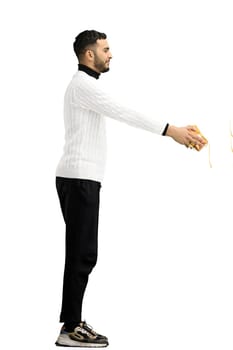 A man, full-length, on a white background, with a gift.