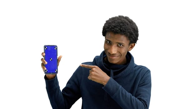 A man, close-up, on a white background, shows a phone.