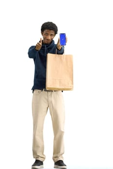 Man, full-length, on a white background, with bags and phone.