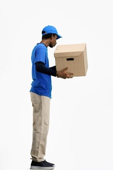 The deliveryman, full-length, on a white background, with a box.