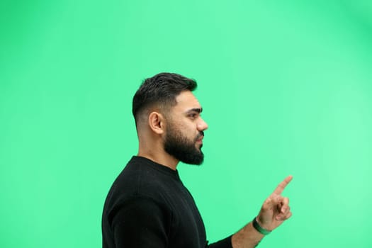 Man, close-up, on a green background.