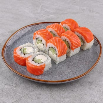 delicious rolls with salmon on a white background studio shooting