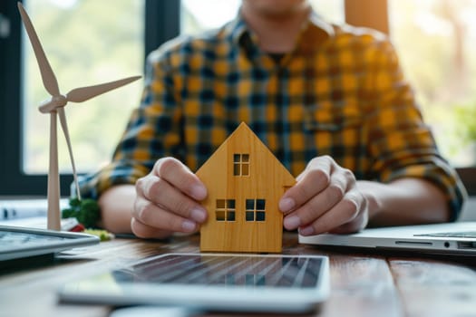 Architect designer hold small wooden house symbol while thinking about home design. Generative AI.