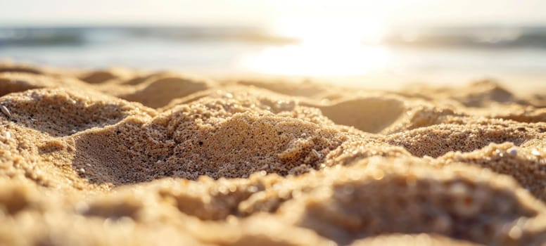 The warm glow of the golden hour casts a soft light on the textured sands of a serene beach, highlighting tranquility.