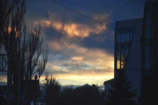 Panoramic skyline and modern commercial buildings with empty road. Asphalt road and cityscape at sunrise