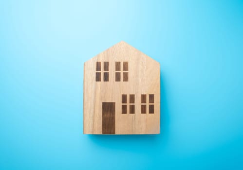 Wooden figures of houses. Buying and selling. Housing options. Affordable housing. Mortgage. Realtor services.