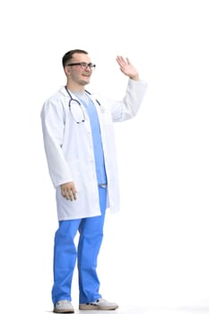 A male doctor, on a white background, in full height, waving his hand.
