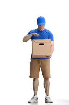 A male deliveryman, on a white background, full-length, with a box, tired.