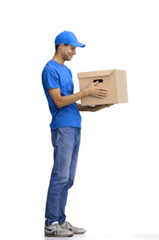 A male deliveryman, on a white background, full-length, with a box.