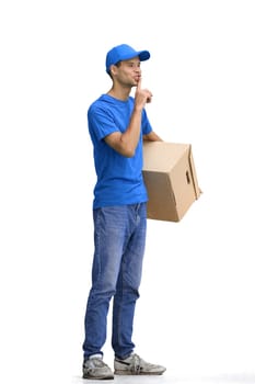 A male deliveryman, on a white background, full-length, with a box.