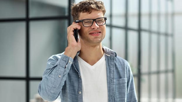 Smiling Businessman Talking on his Phone