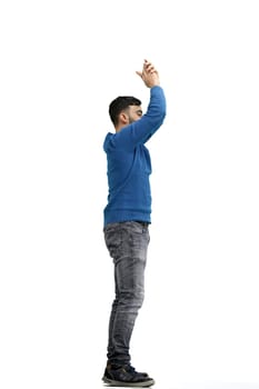 A man, full-length, on a white background, claps.
