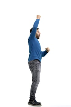 A man, full-length, on a white background, rejoices.