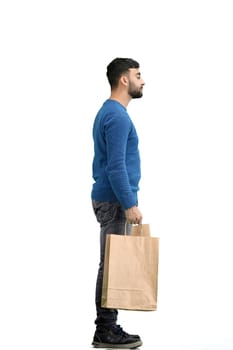 A man, full-length, on a white background, with bags.