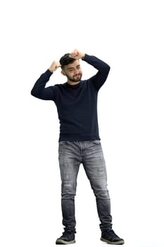 A man, full-length, on a white background, raised his hands up.