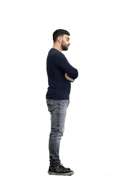 A man, full-length, on a white background, crossed his arms.