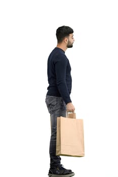 A man, full-length, on a white background, with bags.