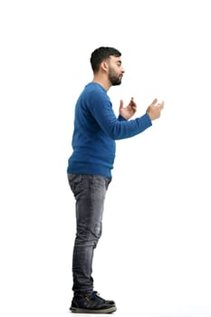 A man, full-length, on a white background, gesture.