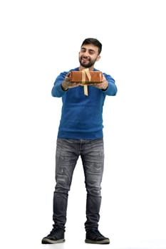 A man, full-length, on a white background, with a gift.
