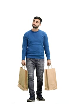 A man, full-length, on a white background, with bags.
