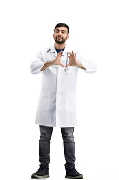 The doctor, in full height, on a white background, shows the heart.