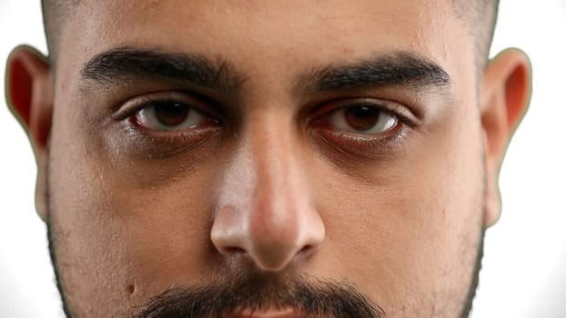 Man's eyes, close-up, on a white background.