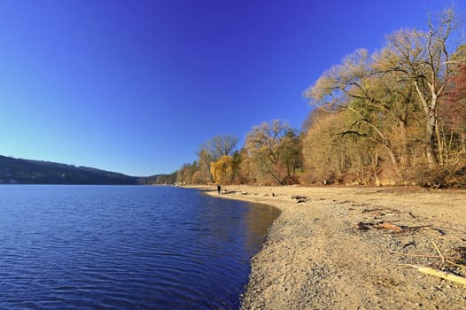 Brno Reservoir - City of Brno - Czech Republic - Europe. Beautiful landscape with water and beach. Nice sunny weather with blue sky in winter time.