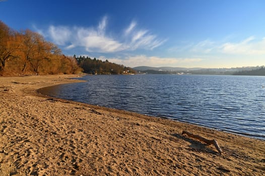 Brno Reservoir - City of Brno - Czech Republic - Europe. Beautiful landscape with water and beach. Nice sunny weather with blue sky in winter time.