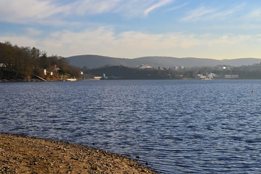 Brno Reservoir - City of Brno - Czech Republic - Europe. Beautiful landscape with water and beach. Nice sunny weather with blue sky in winter time.