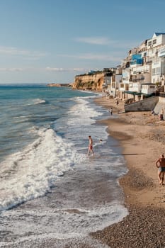 coastal area with apartment buildings of residential areas, modern hotel and restaurant complex on water and sandy beaches