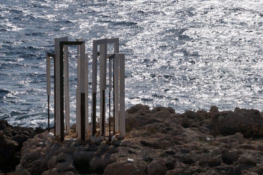 sundial on the seashore in sunlight in Paphos