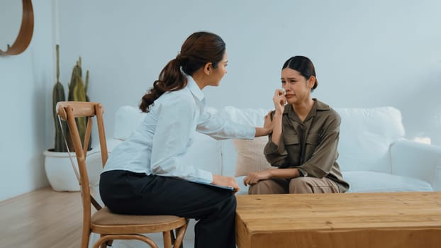 Supportive and comforting hands cheering up depressed patient person or stressed mind with empathy. Psychologist reassuring stressful and sad patient in vivancy clinic.