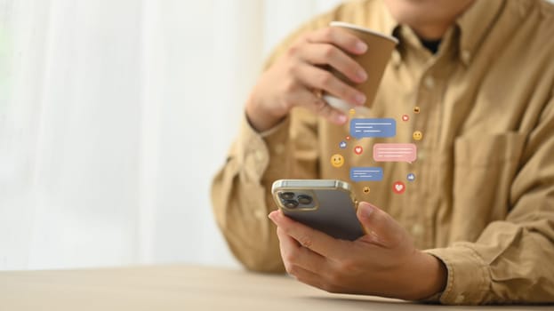 Young woman using mobile phone to interact with social media with notification icons.