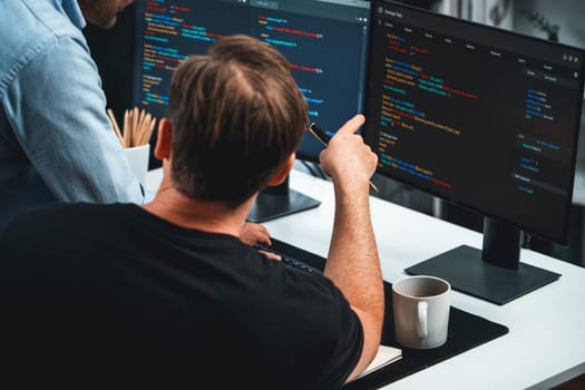 IT developers discussing online software development information on pc screen, creating program coding for latest version application on website. Concept of brainstorming firmware updated. Sellable.