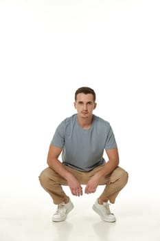 handsome young calm man on white background