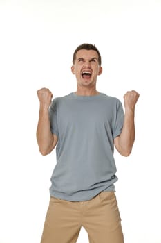 portrait of young man showing victory gesture on white background