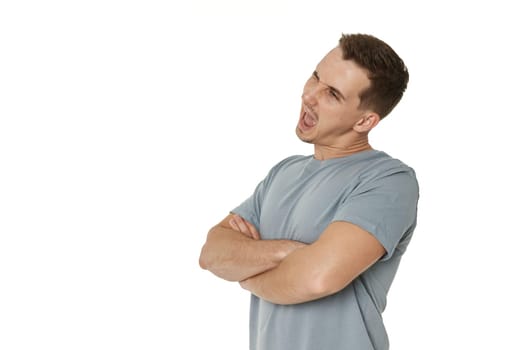 portrait of young happy man winking looking at the camera on white background