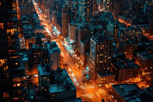 Aerial view of a city street at night time, long exposure of the car lights.