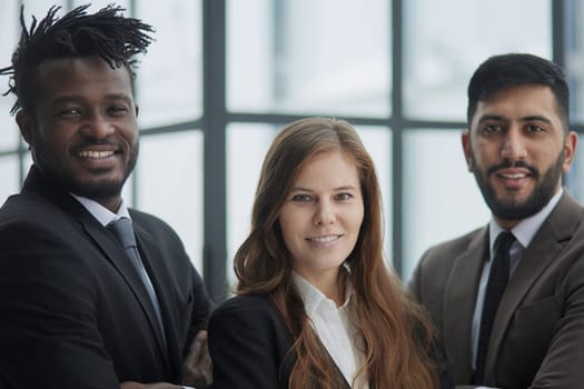 Add ingredient in your success. Young colleagues posing in office