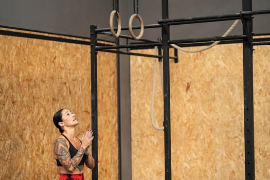 Horizontal photo with copy space of a female athlete about to working out with olympic rings