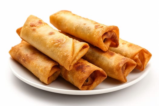 Crispy golden spring rolls on a white plate.