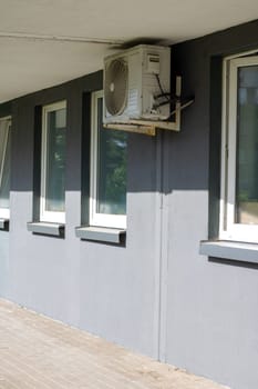 Air conditioners on the wall of a tall building