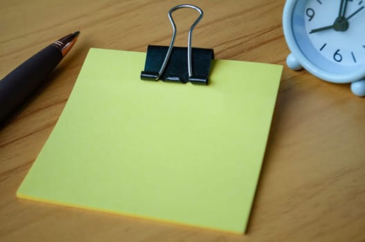Blank sticky notes on wooden table. Copy space.